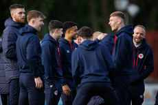 Romal Palmer shares a joke with teammates ahead of the game 19/4/2024