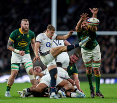 Jack van Poortvliet kicks under pressure from Eben Etzebeth 16/11/2024