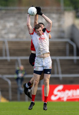 Darren O'Neill of Eire Og Ennis in action against Joe Sweeney 10/11/2024