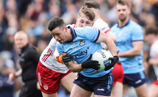 Ross McGarry is tackled by Lorcan McGarrity 24/3/2024