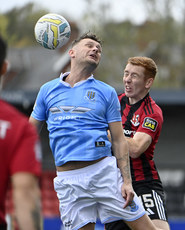 Jarlath O’Rourke with Ballymena’s  Ben Kennedy 25/10/2024