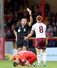 Rob Hennessy shows Aodh Dervin a yellow card  28/6/2024