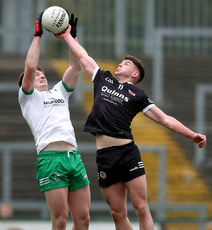 Odhran Murdock and Anthony Morgan compete for a high ball 13/10/2024