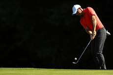 Rory McIlroy chips on to the 8th green 8/9/2023