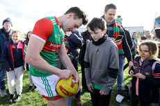 Diarmuid O’Connor signs an autograph after the game 27/2/2022