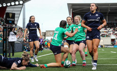 Katie Corrigan celebrates scoring her sides first try with Aoibheann Reilly and Neve Jones 27/4/2024