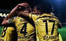 Joe Redmond is congratulated by teammates after scoring his side's third goal of the match 14/10/2024