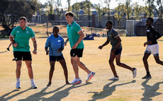 Jordan Larmour and Josh van der Flier with members of the team 3/7/2024