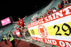 St. Patrick's Athletic fans celebrate winning in front of the full-time scoreboard 4/8/2022