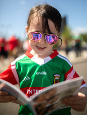 Katie Forde reads the match programme ahead of the game 4/6/2022