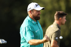 Shane Lowry throws his ball to the crowd after finishing his round 9/9/2023