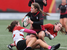 Emer Gilmartin tackled by Sheila Ni Laoire Nic Aodh and Cait Ni Laoire Nic Aodh 15/3/2023