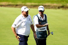 Shane Lowry with his caddy after making par on the 6th 8/9/2023