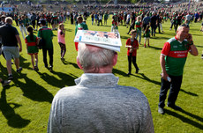 A Mayo fan protects himself with the match day programme after the game 4/6/2022
