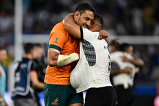 Richard Arnold and Samuel Matavesi hug after the match 17/9/2023