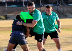 Peter O’Mahony and Tadhg Furlong with a member of the team 3/7/2024