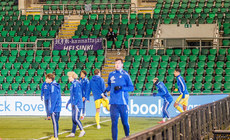 A lone HJK Helsinki fan watches his team warm up ahead of the game 21/11/2024