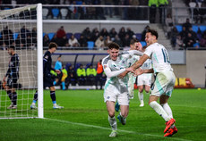 Conor Bradley celebrates with teammates after scoring a goal 18/11/2024