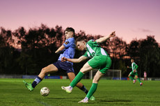 Kieran Cruise clears the ball past Stephen Mohan 28/10/2024