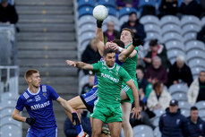 Sean Walsh competes in the air with Ray Connellan and James McCarthy 19/10/2024