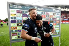 Kyle Steyn presents the BKT United Rugby Championship Player of the Match medal to Sione Tuipulotu 15/6/2024