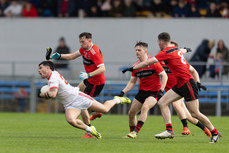 Philip Talty of Eire Og in action against Davy Lyons 10/11/2024