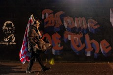 A flag seller outside Weavers Park before the game 18/10/2024