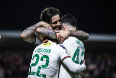 Cathal O'Sullivan celebrates after scoring his side's fourth goal of the match with Ruairi Keating and Sean Maguire 18/10/2024