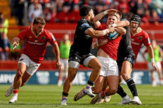 Shane Daly is tackled by Sione Tuipulotu and Huw Jones 15/6/2024