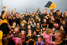 Dr. Crokes players and supporters celebrate at the end of the game with the trophy 27/10/2024