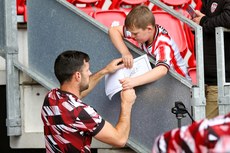 A young Derry fans gets his autograph book signed by Patrick Hoban 28/6/2024