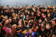 Dr. Crokes players and supporters celebrate at the end of the game with the trophy 27/10/2024