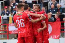 Evan Caffrey celebrates scoring his sides second goal with teammates  28/6/2024