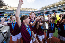 Conor Brassil carries the trophy 21/10/2024