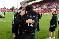 Sione Tuipulotu celebrates after the game with Franco Smith 15/6/2024