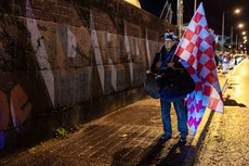 A flag seller outside Weavers Park before the game 18/10/2024