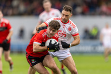 Darragh Lane of Adare in action against Dean Ryan 10/11/2024