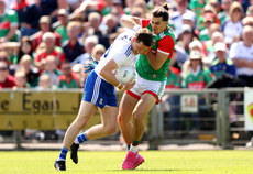 Conor McManus is tackled by Oisin Mullin 4/6/2022