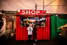 Young Cork City fans make a purchase at the shop kiosk ahead of the game 18/10/2024