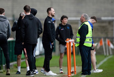 A view of the players inspecting the pitch from the sidelines due to the weather 26/10/2024