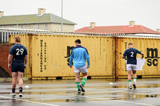 The team warm up in the car park due to the weather 9/7/2024