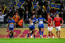 Ruhan Nel celebrates after scoring a try with Suleiman Hartzenberg and Damian Willemse 19/10/2024