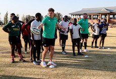 Josh van der Flier and Peter O’Mahony with members of the team 3/7/2024