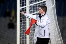 An Umpire waves a red flag to signal a 2-point score 19/10/2024