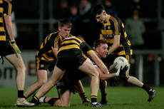 Paul Devlin is tackled by Brandon Boylan, Patrick O Reilly, and Fionn Lovett  9/11/2024