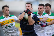 John McGrath is tackled by Tadhg Condon and Joe Higgins 20/10/2024 