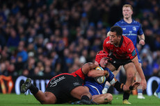 Josh Van der Flier is tackled by Asenathi Ntlabakanye and Rynhardt Jonker 26/10/2024