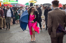 Racegoers shelter from the showers 10/4/2023
