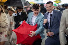 Racegoers shelter from the showers 10/4/2023
