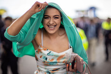 Racegoers shelter from the showers 10/4/2023
